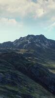 A breathtaking mountain vista from atop a hill video