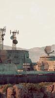 A cluster of antennas on a rooftop at a military base video