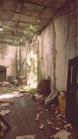 A long hallway filled with debris and signs of abandonment video