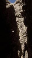 A narrow passage between two large rocks video