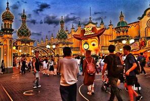 Chiba, Japan on September 30, 2023. Visitors to the Toy Story Mania ride at night. photo