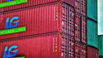 Jakarta, Indonesia on December 6, 2023. Stacks of colorful containers at a logistics warehouse in Cakung. photo