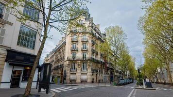 Tranquil Parisian street with classic Haussmannian architecture in spring, ideal for travel and culture themes, especially related to European heritage and urban exploration photo