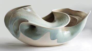 In this piece the artist has transformed the smooth surface of ceramic into a playful of abstract forms. photo