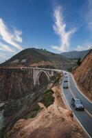 Scenic Coastal Road with Concrete Bridge in Coastal California, USA photo