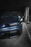 Luxury Sports Car Close Up in Dimly Lit Underground Garage, Los Angeles photo