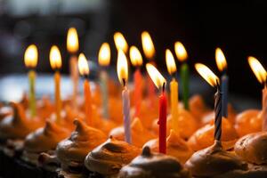 Closeup 15 colorful lit candles at the birthday party at home. Large homemade chocolate cake, decorated with meringues and whipped cream. Celebration concept. Selective focus. photo