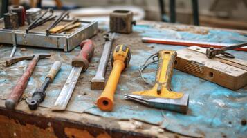 Clamps chisels and levels lay tered on a tarp tools of the trade ready for action as a DIY enthusiast prepares to tackle a bathroom remodel photo