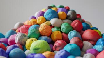 A small mountain of colorful clay balls waiting to be transformed into unique characters for a clay animation project. photo
