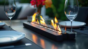 A sleek and modern tabletop fireplace brings an element of sophistication to a casual outdoor dining space. 2d flat cartoon photo
