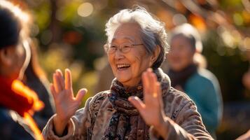 A group of retirees clad in comfortable clothes exchanging smiles as they engage in a Tai Chi session in the refreshing outdoors with the sound of birds chirping in the background photo