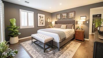 A dramatic transformation of a dull and outdated bedroom with a fresh coat of paint in a rich deep hue adding depth and personality to the space photo