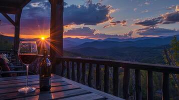 A moment of quiet contemplation as the sun sets behind the mountains accompanied by a glass of red wine on a porch photo