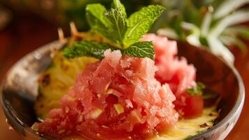 A refreshing watermelon and mint sorbet served in a carvedout pineapple bowl for a touch of tropical flair photo