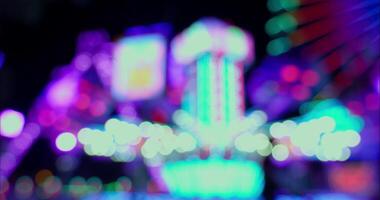 Bokeh Lights Of A Ferris Wheel And Mechanical Rides At An Amusement Park video