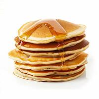 Stack of freshly made pancakes drizzled with syrup on a white background, ideal for breakfast concepts and Shrove Tuesday celebrations photo