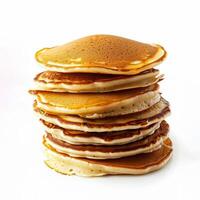 Stack of freshly cooked golden brown pancakes isolated on a white background, perfect for Shrove Tuesday and breakfast concept imagery photo