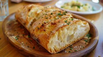 The chefs homemade sourdough bread served warm and crispy is the perfect accompaniment to the flavorful dishes photo