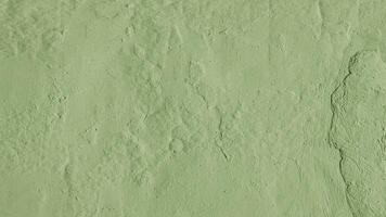 Stucco plaster wall background texture of khaki painted cement, concrete wall photo