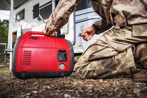 RV Owner Firing Portable Electricity Generator photo