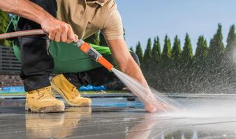 Poolside Washing Using Garden Hose photo