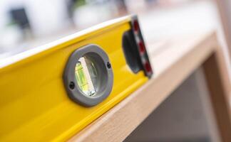 Professional Spirit Level on a Wooden Counter Top photo