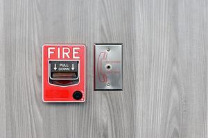 Fire alarm switch box on wall for warning with copy space photo
