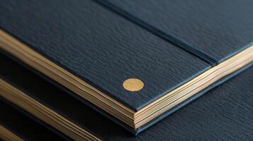 A set of minimalist notepads bearing a simple yet elegant gold foil logo perfect for modern and chic communication photo