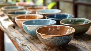 A set of salad bowls each with a different glaze color making them both practical and visually appealing. photo