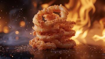 Tantalizing fried onion straws surrounded by a fiery backdrop offer a perfect balance of crunch and flavor photo