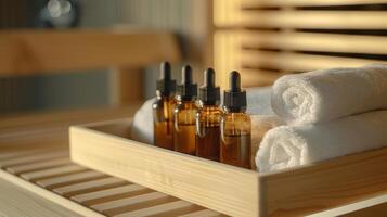A tray of essential oils and towels ready for a reflexology session at the sauna. photo