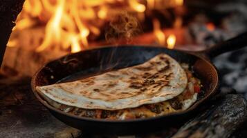 A deliciously charred quesadilla stuffed with succulent chunks of beef and a blend of y peppers sizzling on a cast iron skillet over a cozy fireside. The aroma of sizzlin photo