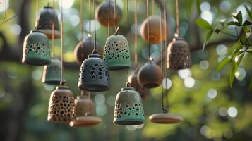 A handshape ceramic wind chime featuring a mix of textured hanging pieces and intricately shaped bells. photo