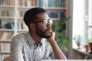 AI generated Reflective African American Man with Glasses in a Cozy Study Room photo