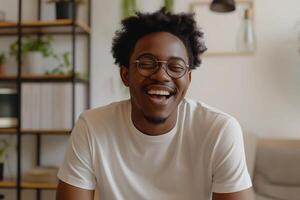 AI generated Joyful Young African American Man with Glasses Laughing Indoors photo