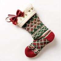Traditional Knitted Christmas Stocking with Festive Patterns and Red Bow photo