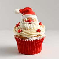 Festive Christmas Cupcake with Santa Claus Topper on White Background photo