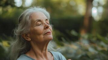 Serene Elderly Woman Enjoying a Moment of Solitude in Lush Garden photo