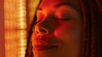 The persons calm expression conveys the deep relaxation and detoxification of an infrared sauna experience. photo