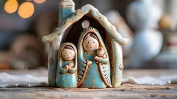A ceramic nativity scene with intricately crafted figurines of Mary Joseph and baby Jesus in a rustic stable. photo