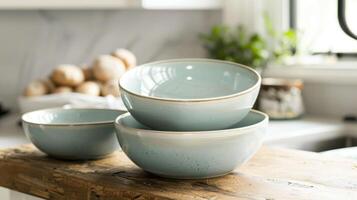 A set of nesting bowls in various sizes each with a smooth glaze finish for easy cleaning and a modern touch. photo