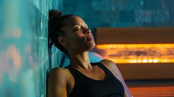 A person with fibromyalgia takes a break from their busy day at work to relax in a sauna in the workplace wellness center. As the heat soothes their tired muscles they feel a renewed photo