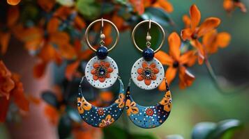 A pair of statement earrings handmade with a mixture of polymer clay and ceramic beads resulting in a modern and eclectic accessory. photo