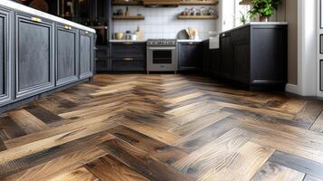 A closeup of a herringbone wood floor in a modern kitchen with contrasting light and dark tones adding depth and texture to the space photo