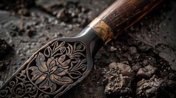 A closeup shot of a handcrafted wooden handle with intricate details on a set of premium gardening tools photo