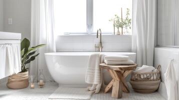 In this bathroom the homeowner pays homage to their Scandinavian roots with minimalist design clean lines and a neutral color palette. A wooden stool and candle holders ad photo