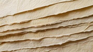 A stack of pristine textured watercolor paper ready to provide the perfect surface for imaginative paintings photo