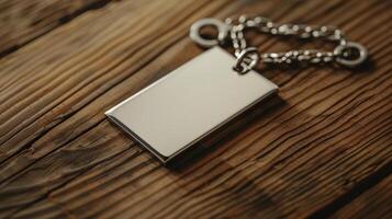 Blank mockup of a charm necklace style keychain with a blank pendant for engraving. photo