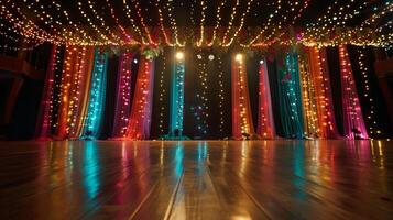 A shot of the stage decorated with ling lights and colorful streamers creating a fun and festive atmosphere photo