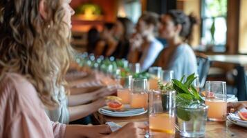 A yoga class ends with a mindful mocktail meditation where participants gather around a communal table slowly drinking their beverages while a guide leads them through a visualizatio photo